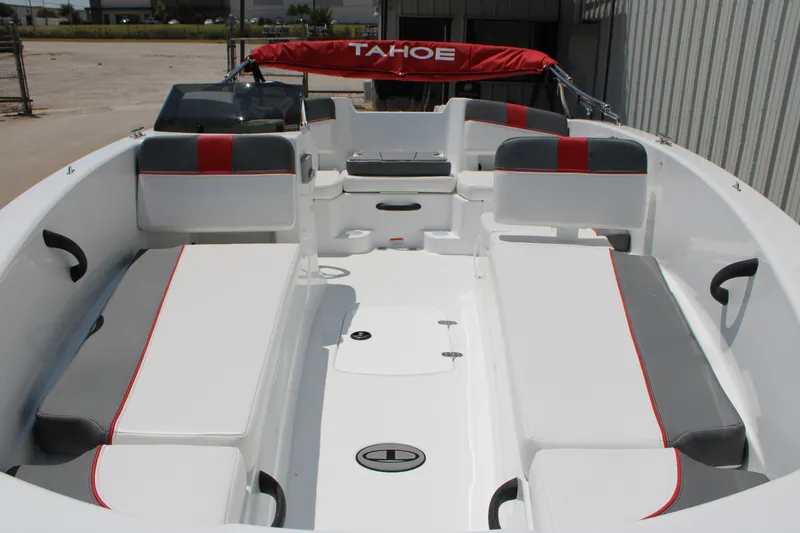 Slide: The Image of 2027 Tahoe T18 boat interior with white and gray seating, red accents, and open deck layout. - 6