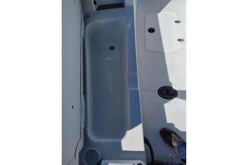 Slide: The Image of 2027 Tahoe T18 boat interior showing storage compartment and deck details. - 4
