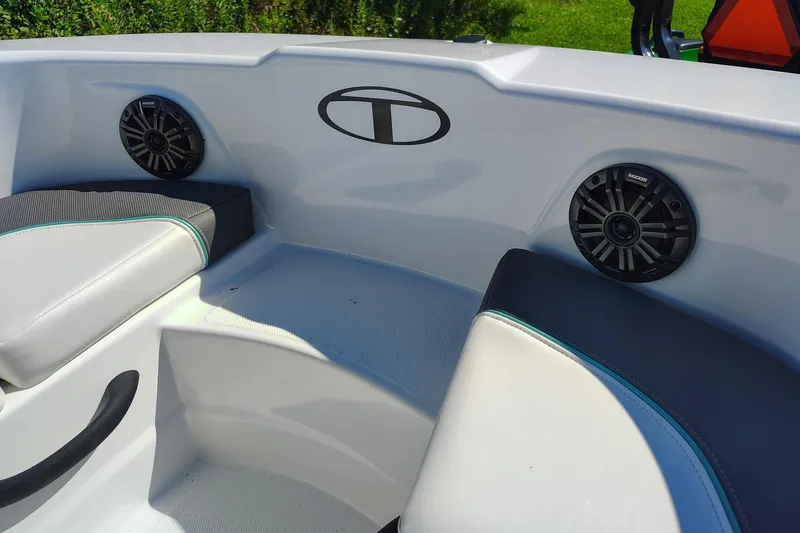 Slide: The Image of Interior of 2027 Tahoe T18 boat with speakers and cushioned seating. - 6