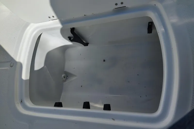 Slide: The Image of Open storage compartment in 2027 Tahoe T18 boat, showing interior details. - 5