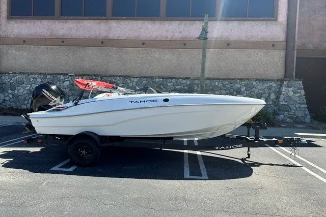 The Image of 2027 Tahoe T18 boat on trailer in parking lot, side view. - 0