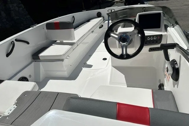 Slide: The Image of 2027 Tahoe T18 boat interior with modern steering and seating. - 9