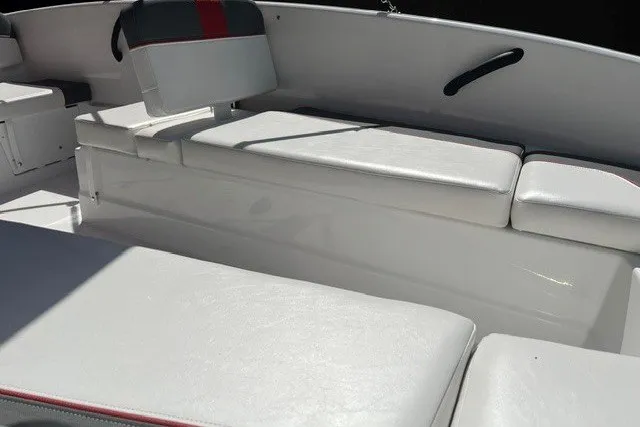 Slide: The Image of Interior seating of a 2027 Tahoe T16 boat with white cushions and red accents. - 6
