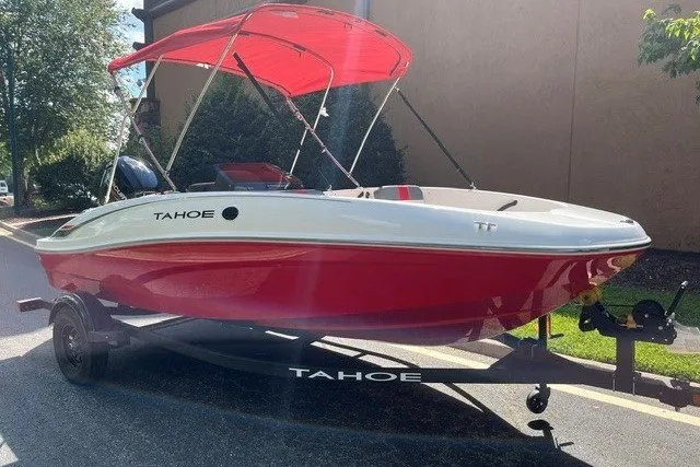 Slide: The Image of Red and white 2027 Tahoe T16 boat with canopy on trailer. - 3