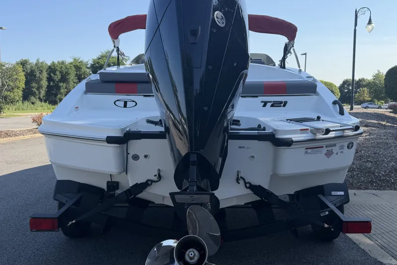Slide: The Image of Rear view of a 2027 Tahoe T21 boat with an outboard motor. - 5