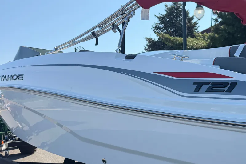 Slide: The Image of 2027 Tahoe T21 boat with sleek white design and modern detailing. - 10