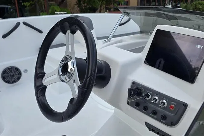 Slide: The Image of Steering console of 2027 Tahoe T18 boat with modern controls and touchscreen display. - 8