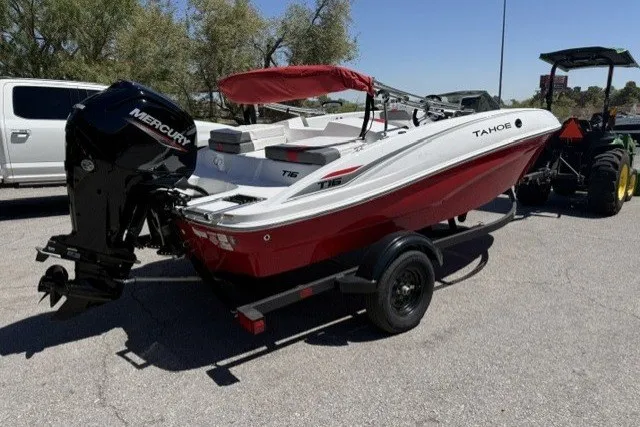 Slide: The Image of 2027 Tahoe T16 boat with Mercury engine on trailer, parked outdoors. - 4