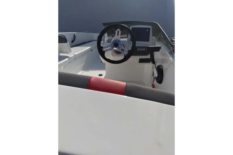 Slide: The Image of 2027 Tahoe T18 boat interior with steering wheel and dashboard. - 3