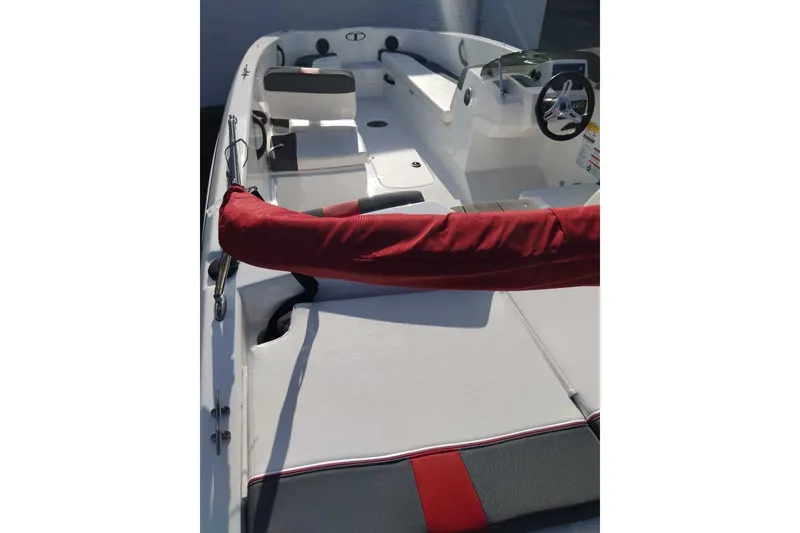 Slide: The Image of 2027 Tahoe T18 boat interior with red accents and steering wheel. - 4