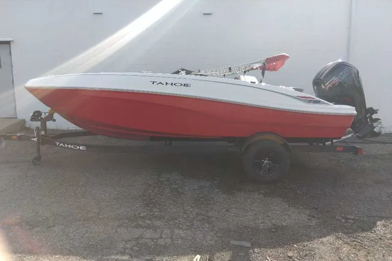 The Image of 2027 Tahoe T18 boat with red and white design on a trailer. - 0