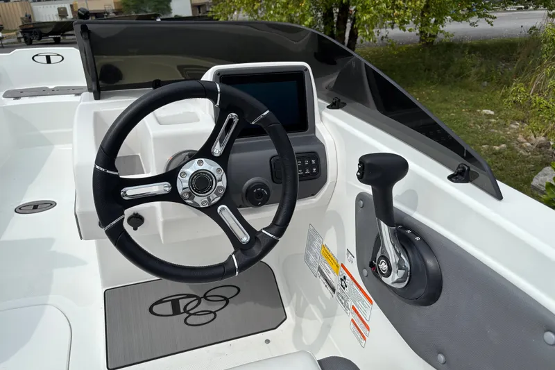 Slide: The Image of Steering wheel and controls of 2027 Tahoe T21 boat cockpit. - 4