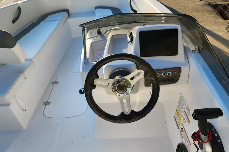 Slide: The Image of 2027 Tahoe T16 boat interior with steering wheel and control panel. - 4
