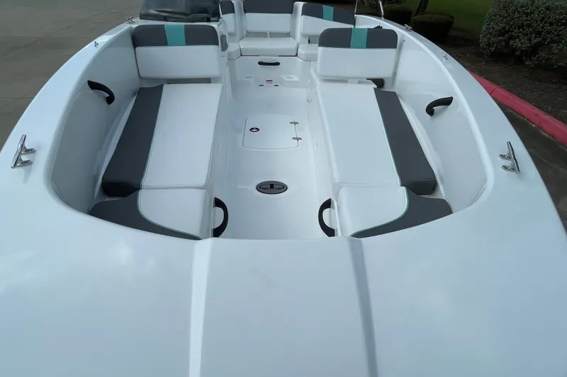 Slide: The Image of 2027 Tahoe T18 boat interior with sleek white and gray seating, modern design. - 6
