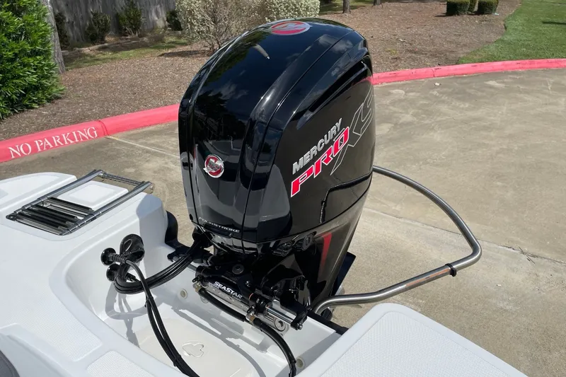 Slide: The Image of 2027 Tahoe T18 boat with Mercury Pro XS outboard motor in a parking area. - 11