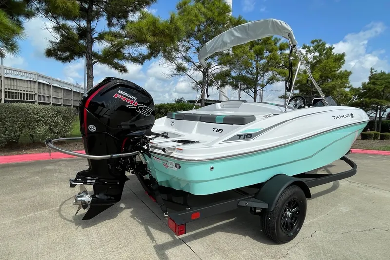 Slide: The Image of 2027 Tahoe T18 boat with Mercury Pro XS engine on trailer, parked outdoors. - 4