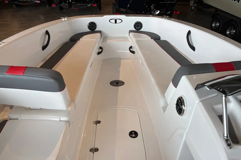Slide: The Image of 2027 Tahoe T18 boat interior with cushioned seating and modern design. - 2