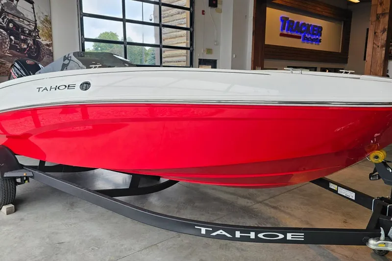 The Image of 2027 Tahoe T18 boat with red and white design on display indoors. - 0