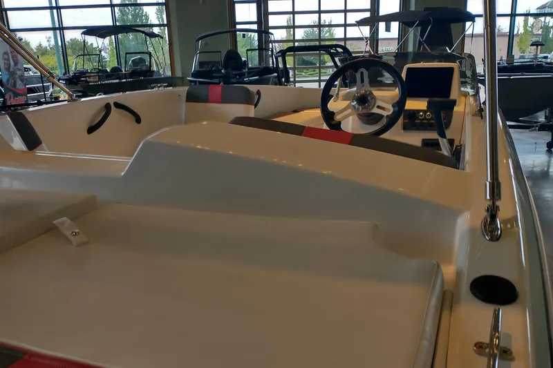 Slide: The Image of Interior view of a 2027 Tahoe T18 boat, showcasing steering wheel and dashboard. - 3