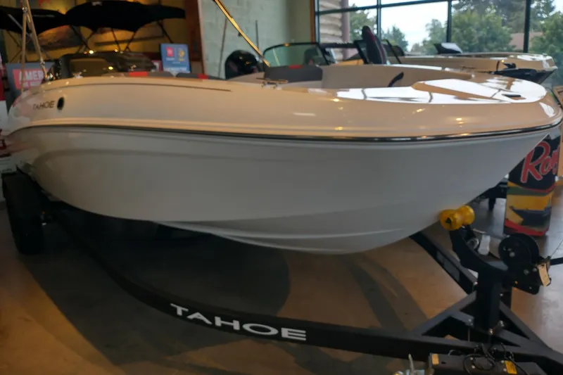 The Image of 2027 Tahoe T18 boat displayed indoors on a trailer. - 0