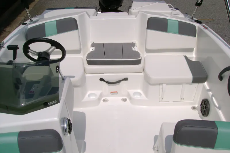 Slide: The Image of 2027 Tahoe T16 boat interior with modern seating and steering wheel design. - 10