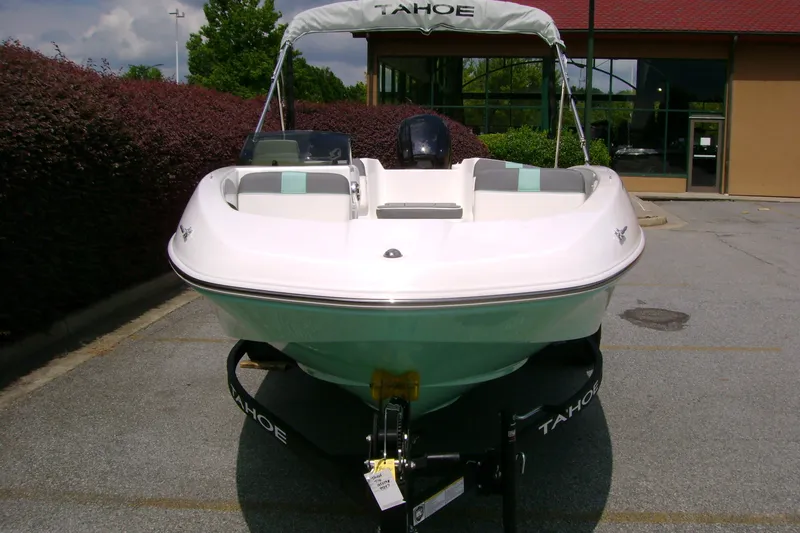 Slide: The Image of 2027 Tahoe T16 boat on trailer, parked outdoors, front view. - 6