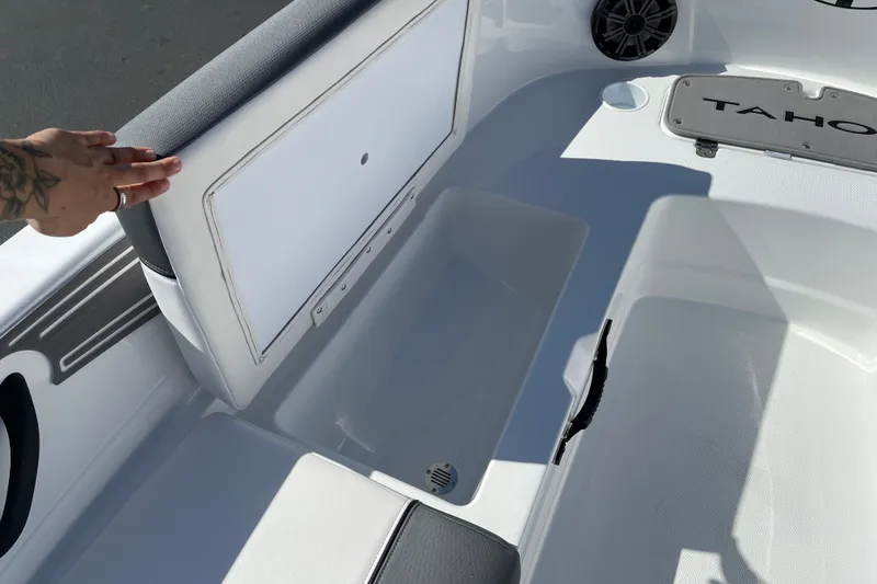 Slide: The Image of Interior of 2027 Tahoe T21 boat showing storage compartment and seating area. - 22