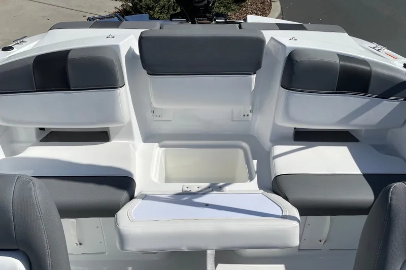 Slide: The Image of Interior seating of 2027 Tahoe T21 boat with gray and white upholstery. - 14