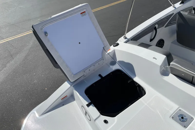 Slide: The Image of Open storage compartment on 2027 Tahoe T21 boat, showcasing sleek design and functionality. - 29