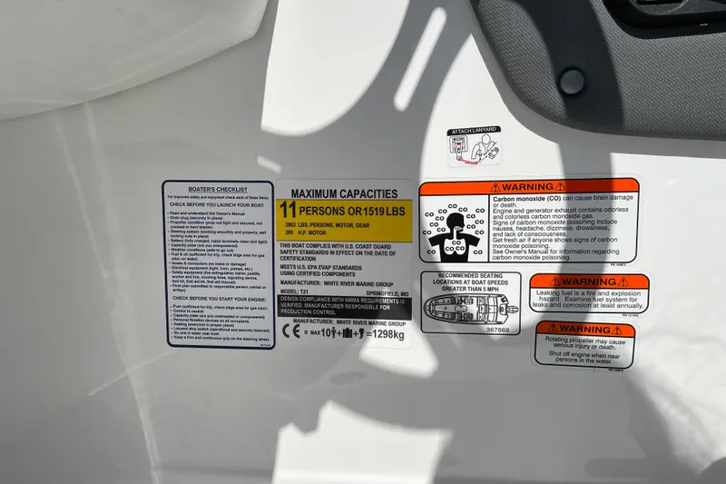 Slide: The Image of Safety and capacity labels on a 2027 Tahoe T21 boat, detailing maximum load and warnings. - 31