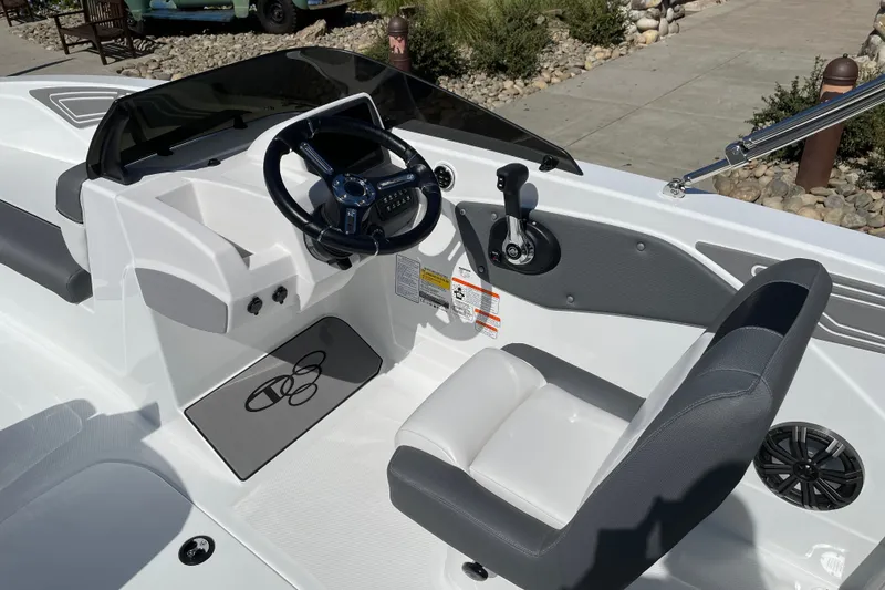 Slide: The Image of Cockpit of 2027 Tahoe T21 boat with steering wheel and control panel. - 10