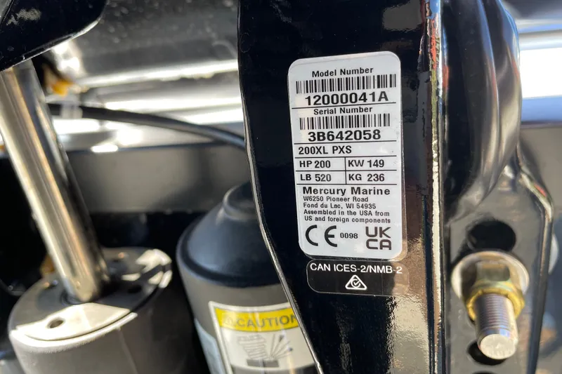 Slide: The Image of Close-up of Mercury Marine engine label on a 2027 Tahoe T21 boat. - 118