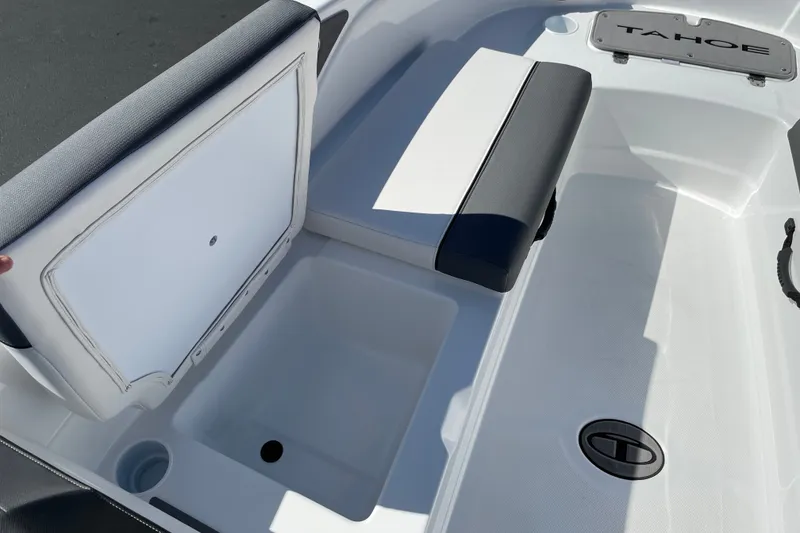 Slide: The Image of 2027 Tahoe T21 boat interior with storage compartment and seating. - 21