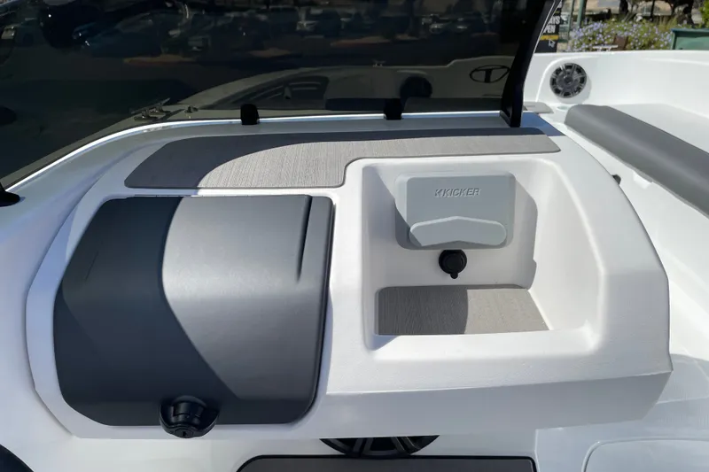 Slide: The Image of Interior of 2027 Tahoe T21 boat featuring a Kicker audio system and sleek design. - 18