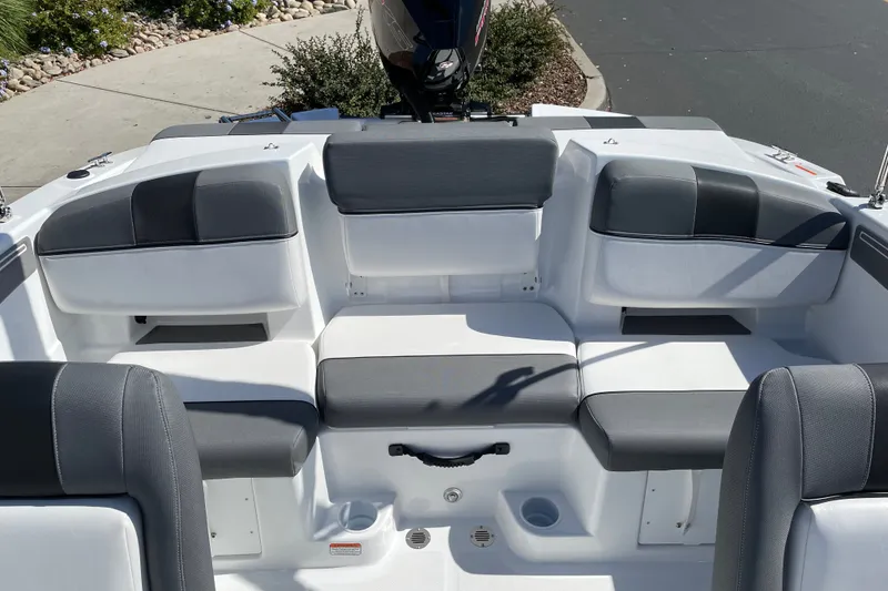 Slide: The Image of Interior seating of 2027 Tahoe T21 boat with gray and white upholstery. - 13