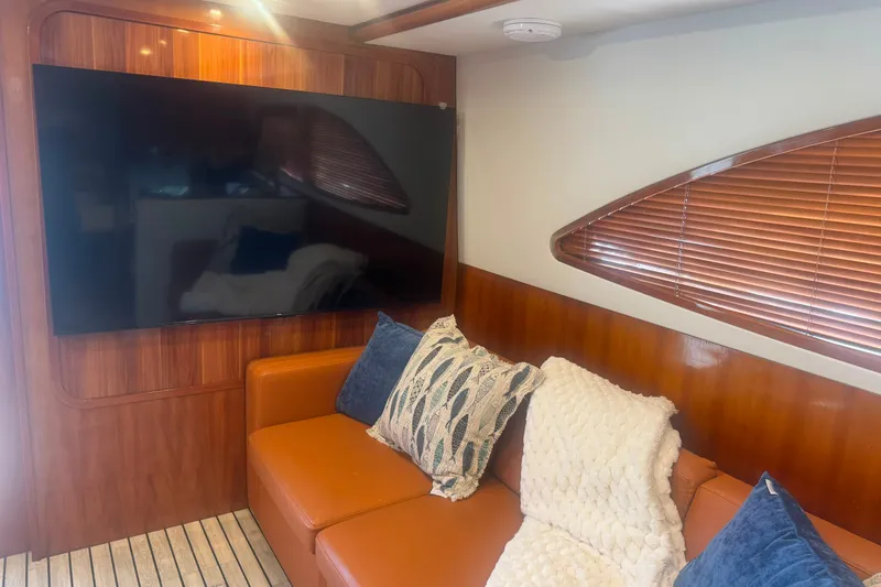 Slide: The Image of Luxurious interior of 2003 Bertram 450 Convertible yacht with cozy seating and modern decor. - 11
