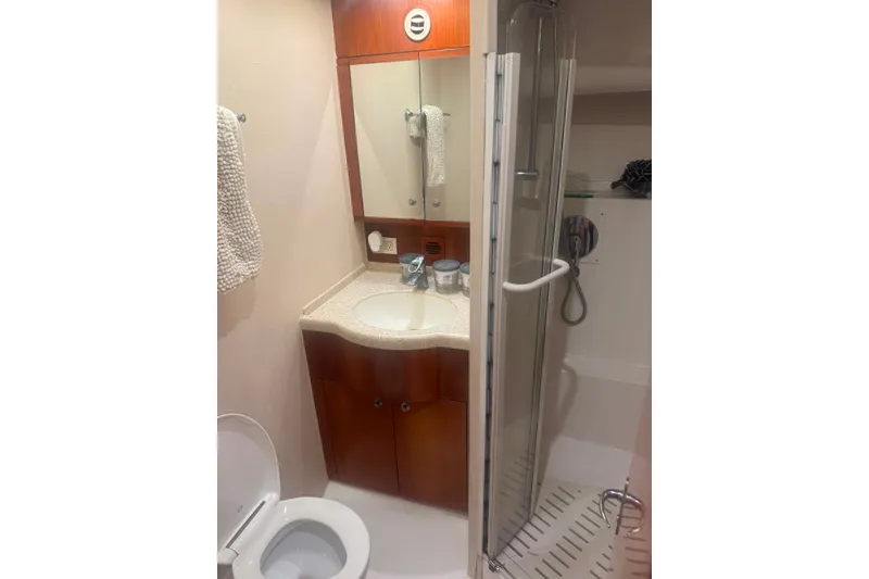 Slide: The Image of Bathroom interior of 2003 Bertram 450 Convertible yacht with shower and vanity. - 12