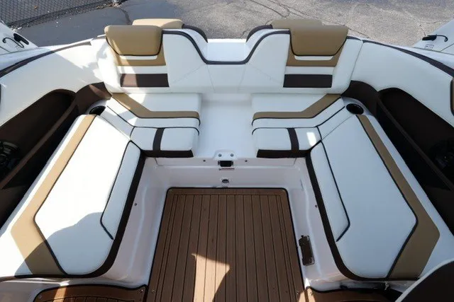 Slide: The Image of Interior seating of 2022 Yamaha 212 boat with white and tan upholstery. - 16