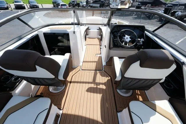 Slide: The Image of 2022 Yamaha 212 boat interior with sleek design and modern dashboard. - 12