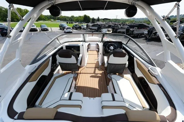 Slide: The Image of 2022 Yamaha 212 boat interior with sleek seating and modern dashboard design. - 8
