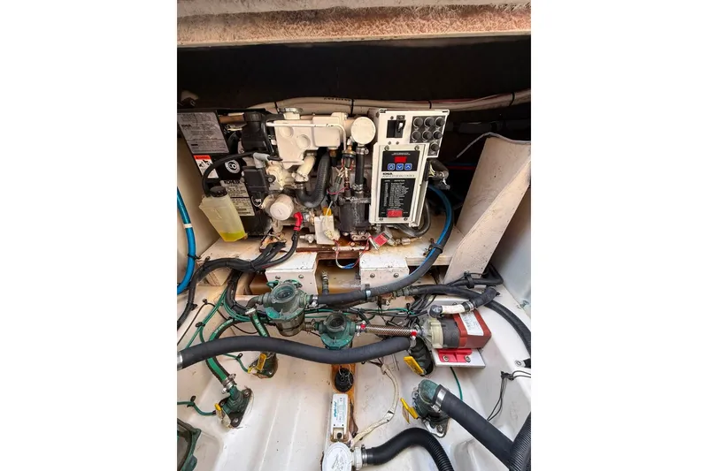 Slide: The Image of Engine compartment of a 2007 Sea Ray Sundancer 260 boat, showcasing mechanical components. - 9