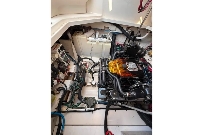 Slide: The Image of Engine compartment of a 2007 Sea Ray Sundancer 260 boat, showcasing mechanical components. - 22