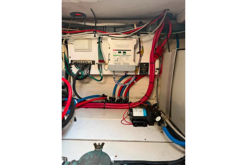 Slide: The Image of Electrical wiring and components inside a 2007 Sea Ray Sundancer 260 boat. - 10
