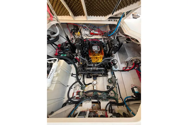 Slide: The Image of Engine compartment of a 2007 Sea Ray Sundancer 260 boat, showcasing detailed wiring and components. - 21