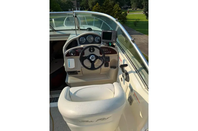 Slide: The Image of Cockpit of 2007 Sea Ray Sundancer 260 with steering wheel and navigation equipment. - 18