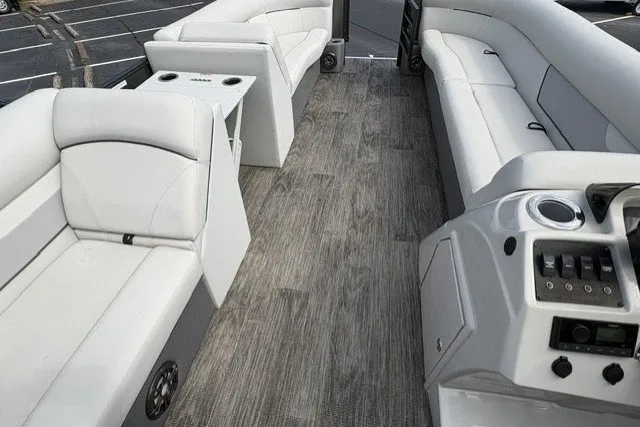 Slide: The Image of 2022 Crest CLASSIC FISH 220SF boat interior with white seating and modern console. - 7