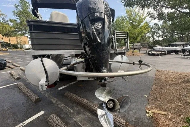 Slide: The Image of 2022 Crest CLASSIC FISH 220SF boat with outboard motor in a parking lot. - 4