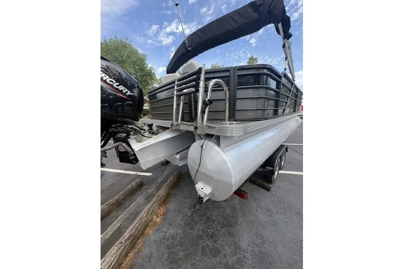 Slide: The Image of 2022 Crest Classic Fish 220SF pontoon boat with Mercury outboard motor in parking lot. - 11