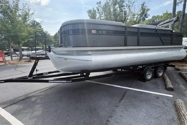 Slide: The Image of 2022 Crest CLASSIC FISH 220SF pontoon boat on trailer in parking lot. - 2