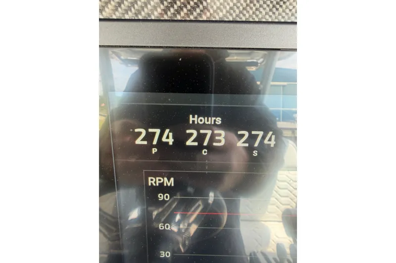 Slide: The Image of Display panel of 2022 Nor-Tech 340 Sport showing engine hours and RPM. - 31